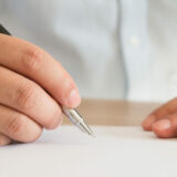 Businessman signing documents